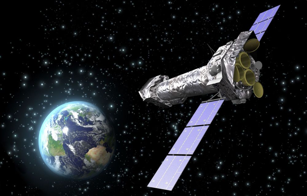 Visió artística del XMM-Newton observant l'espai en òrbita al voltant de la Terra - Crèdit: ESA/C. Carreau